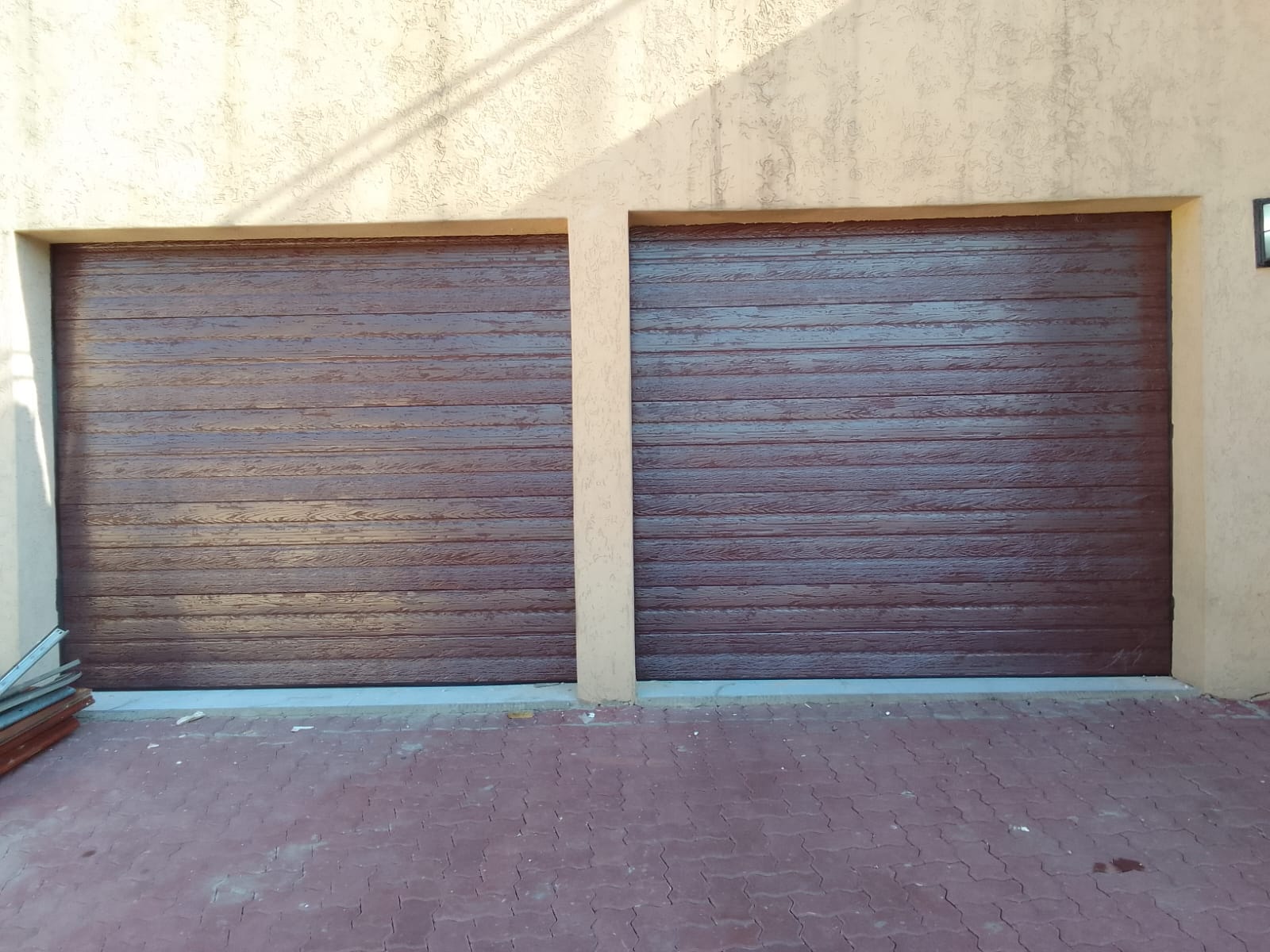 Wood-finish sectional garage doors