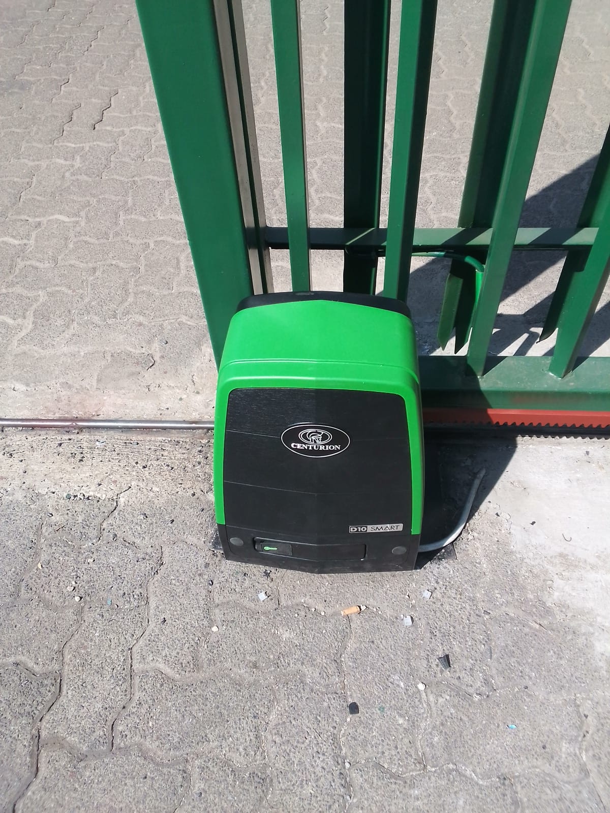 Centurion D10 Smart on green palisade gate