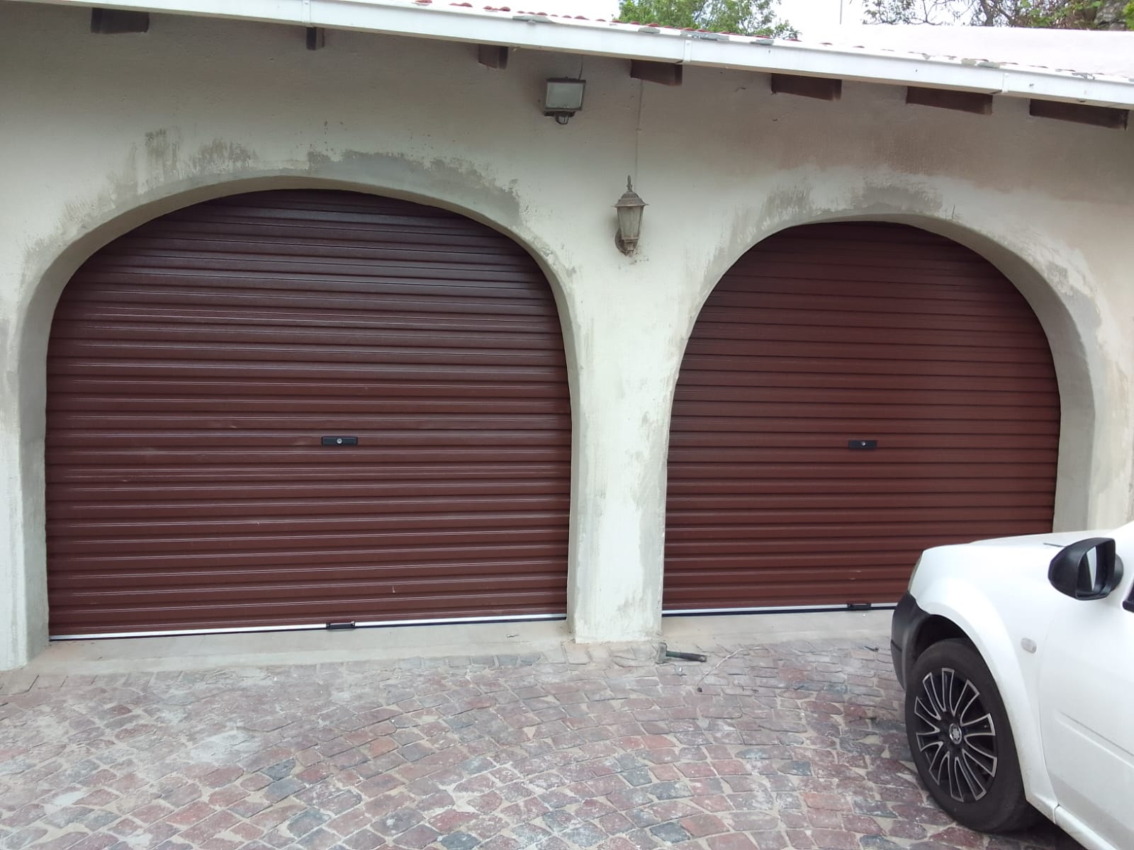 Twin arched roller garage doors