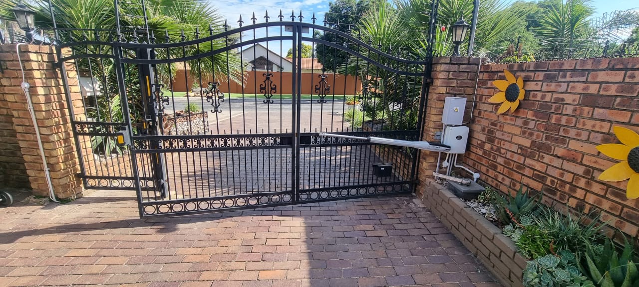 Black wrought iron gate with Centurion motor